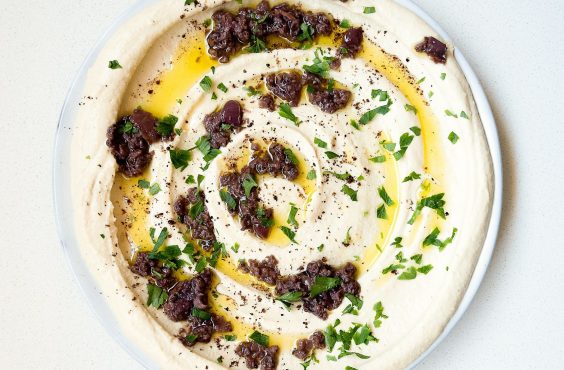 Hummus with olive pesto and sundried tomatoes