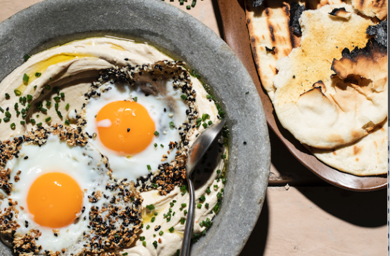 Sesame fried eggs on tahini-yoghurt