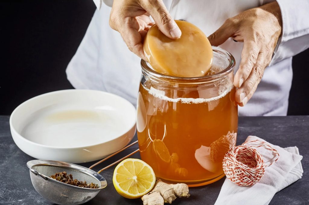 An image of someone making kombucha